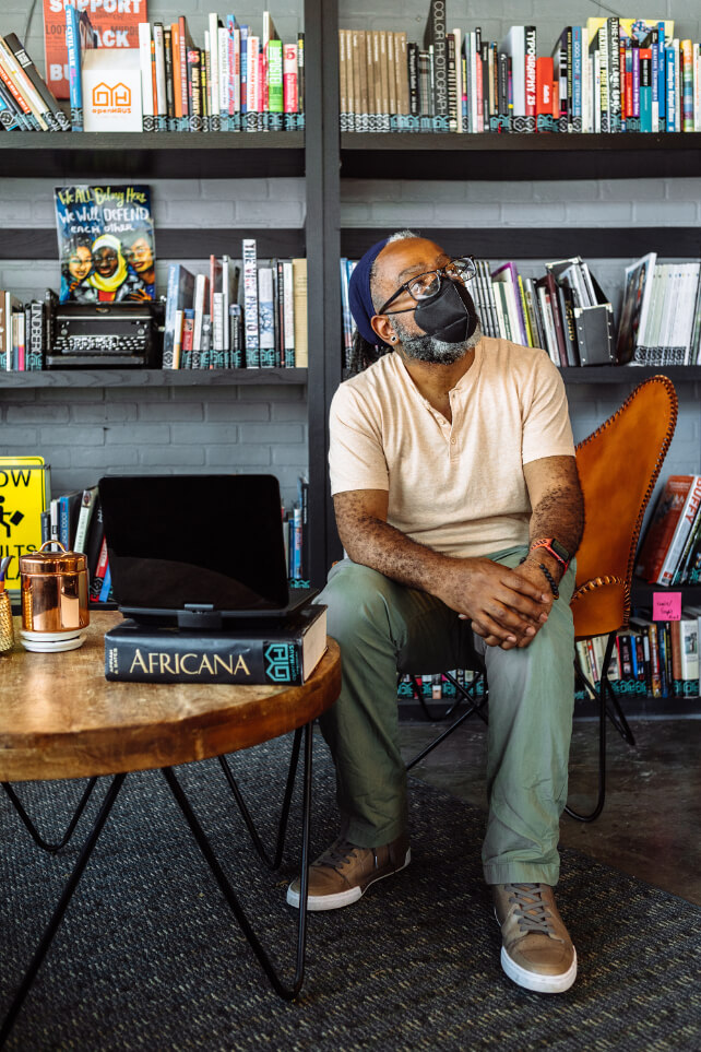 Andre in front of books